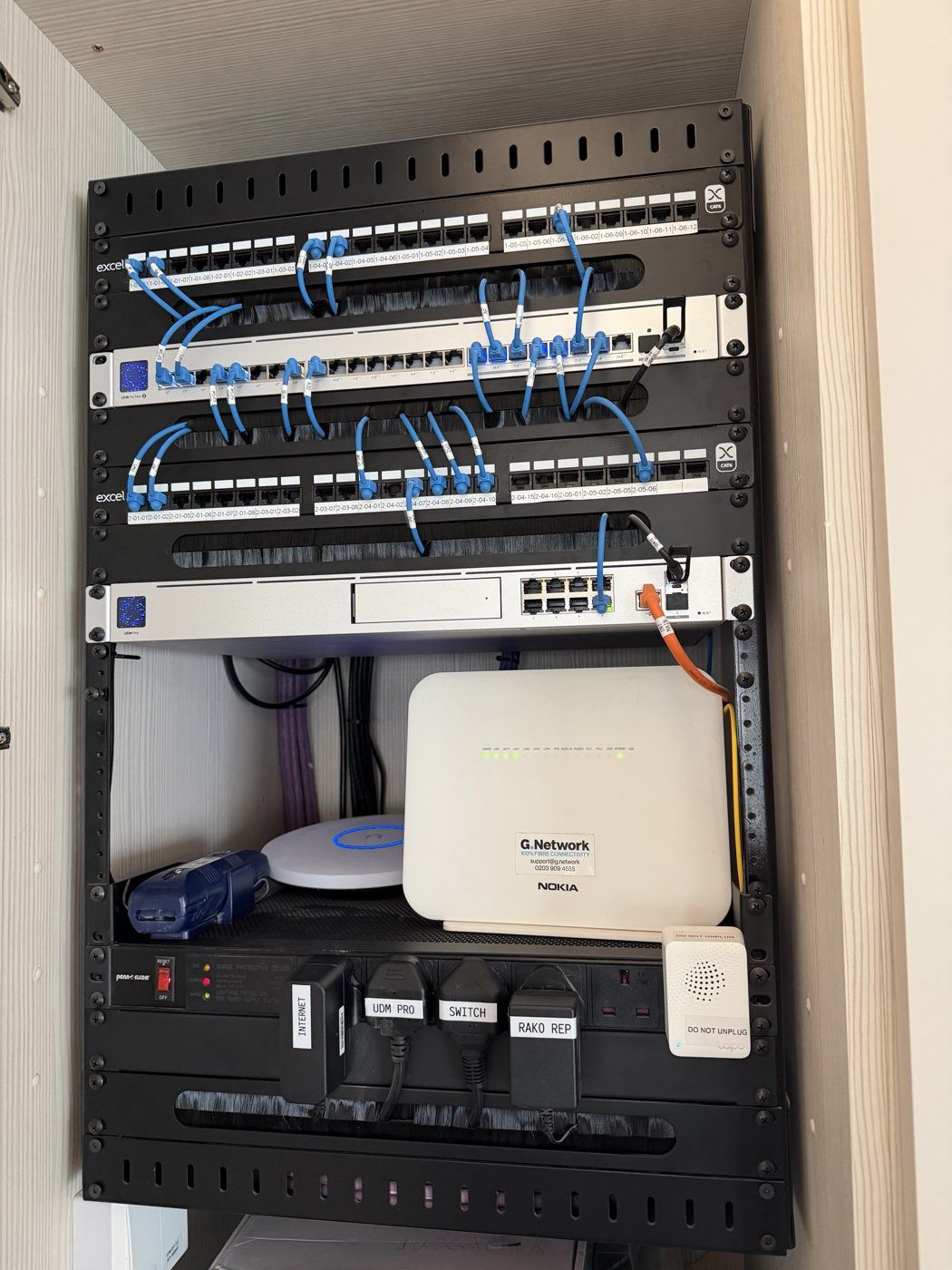 Neatly patched and labelled network cabinet installed by the CareHomeWiFi.com team